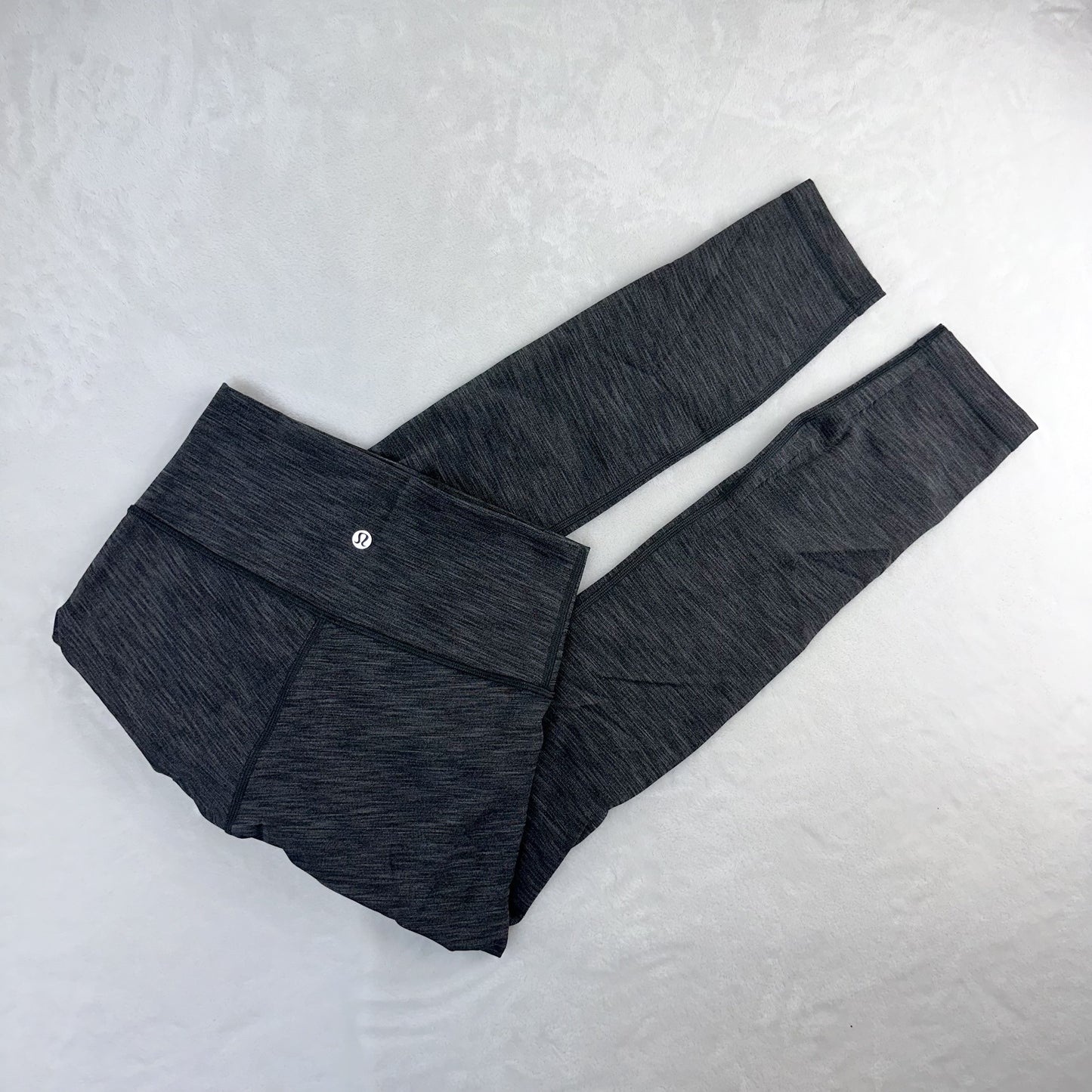 Size 4 Heathered Black Wunder Under 25”